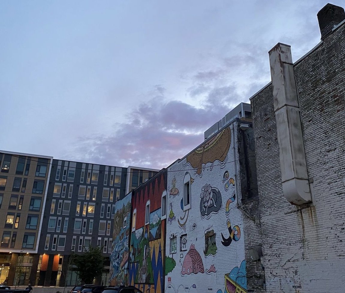 downtown Vancouver Washington. Back alley mural. fishes and paintings. skyline.